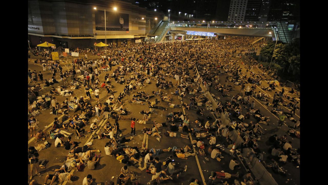 Protesters occupy a main road in the Central district of Hong Kong after riot police used tear gas against them on Sunday, September 28.