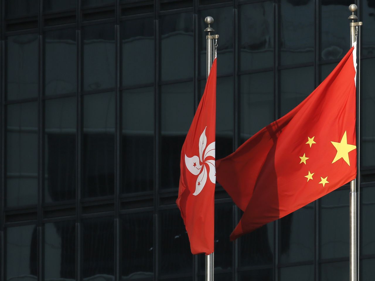 Protesters turn the Chinese flag upside-down on September 29 outside a commercial building near the main Occupy Central protest area in Hong Kong.
