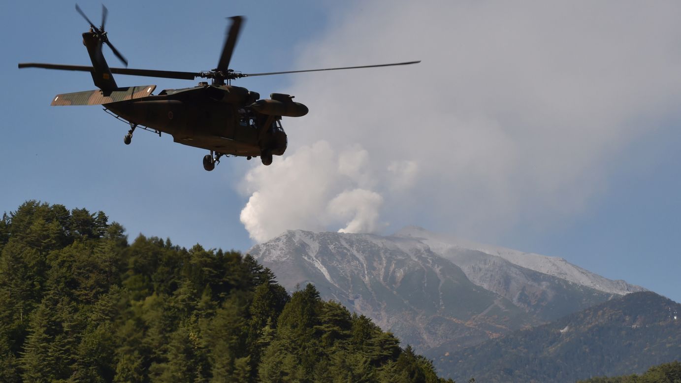 A military helicopter leaves a temporary landing site for a rescue mission on Monday, September 29. Witnesses described hearing a sound like thunder as the volcano began to erupt two days earlier.