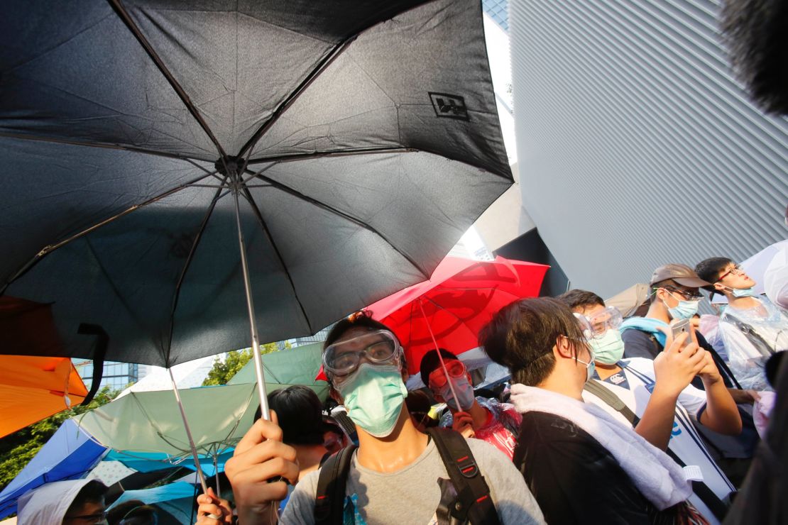 Protesters used umbrellas to block pepper spray and tear gas used by riot police.