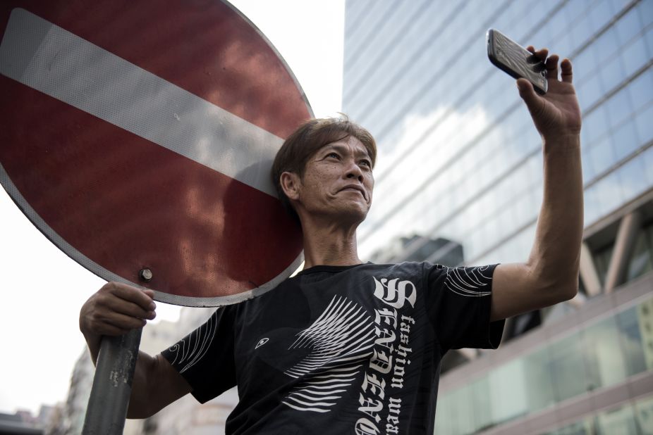 If the image of the barricade defined protest and dissent in the 20th century, the mobile phone is defining it in the 21st century. The ability of protesters to organize and mobilize quickly through mass communication has been critical for civil disobedience movements like 'Occupy Central' in Hong Kong.