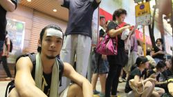 Chung, 30, has been here 2-3 hours. Too many people in Admiralty, he says. He's an actor, here with a group of friends. Wearing cooling strip on his forehead (lots of people wearing these, pretty hot night) . Needs to work tomorrow. Haven't seen any police. "Keep alert to everyone, everywhere. Undercover cops here for sure."
 He went to Admiralty two days ago, Mong Kok yesterday. "No way CY will change his mind. I tutor drama so when I see students on the street I get upset and as an adult I need to come out to support - to stand in front"
