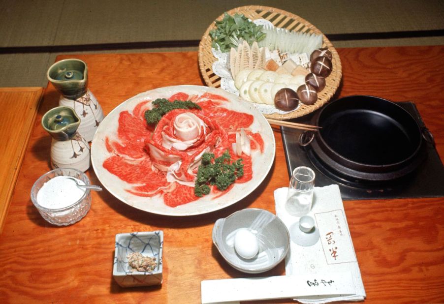 Sukiyaki simmers thin slices of beef in a pot with vegetables, usually bathed in a sauce made with soy sauce, sugar and sake. 