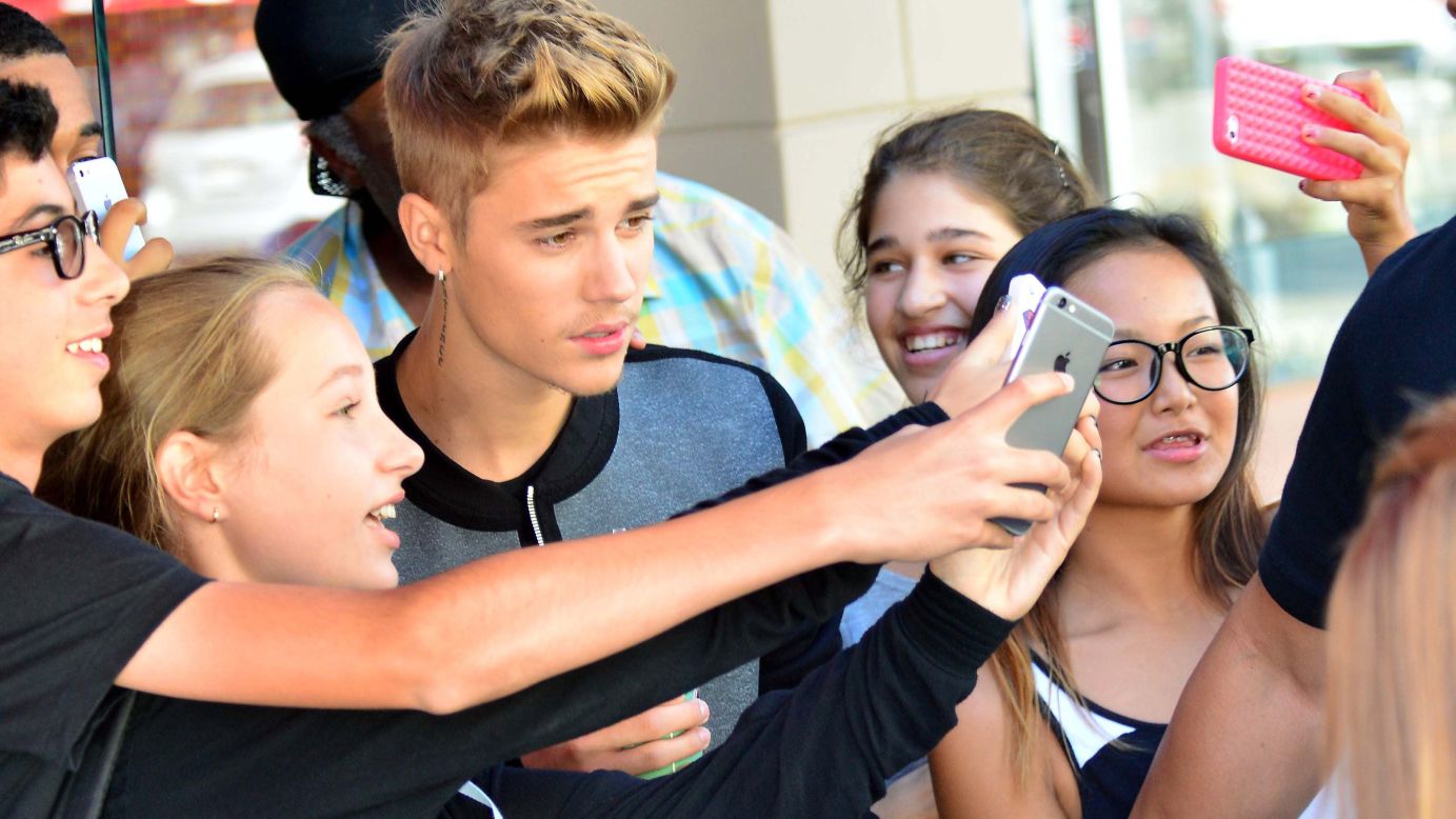 Singer Justin Bieber is mobbed by fans as he leaves a sandwich shop in Beverly Hills, California, on Monday, September 29. <a href="http://www.cnn.com/2014/09/24/living/gallery/look-at-me-0924/index.html">See 21 selfies from last week</a>