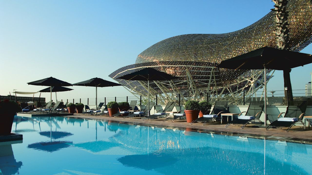 Hotel Arts Barcelona is easily identifiable thanks to its Frank Gehry-designed golden steel fish statue, which overlooks the pool. 