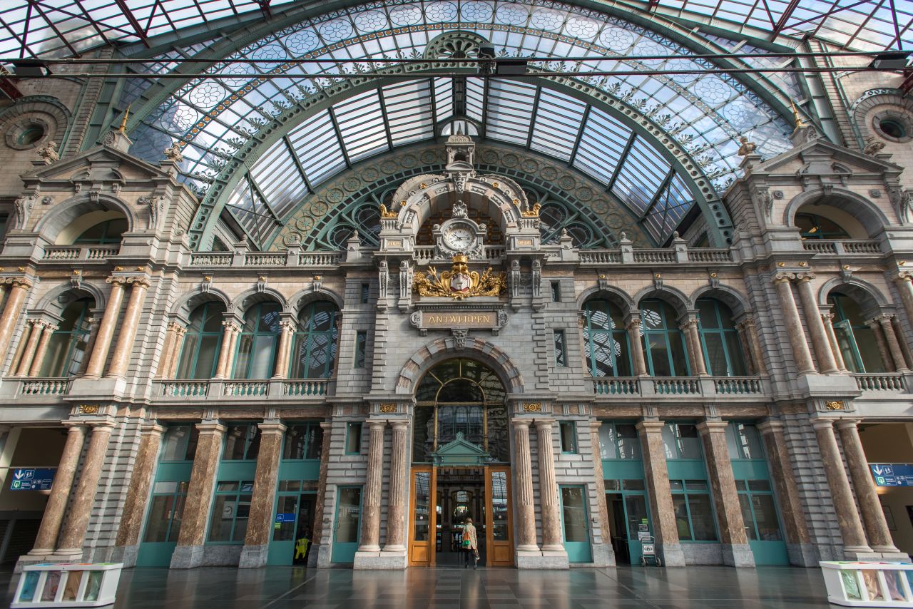 The stone-clad Antwerpen-Centraal is such an eclectic mix of designs that it has no designated architectural style. Its vast dome covering the waiting room and vast iron and glass train shed earned the station the nickname "Railway Cathedral."