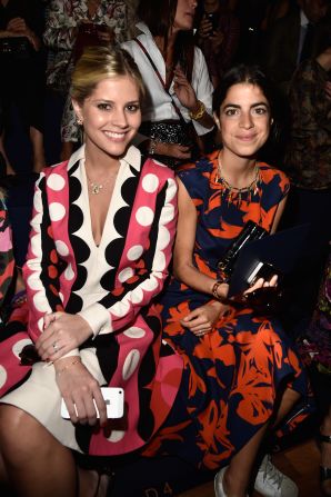 Lala Rudge and Leandra Medine (of the infamous blog Man Repeller) attend the Valentino show wearing striking colorful prints. 