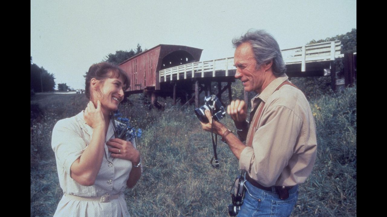 <strong>"The Bridges of Madison County":</strong> Robert James Waller's 1992 novel about the romance between a lonely Iowa farm wife and a National Geographic photographer lingered on bestseller lists for three years and sold 50 million copies. Clint Eastwood stars in (and directs) the 1995 movie version with Meryl Streep.