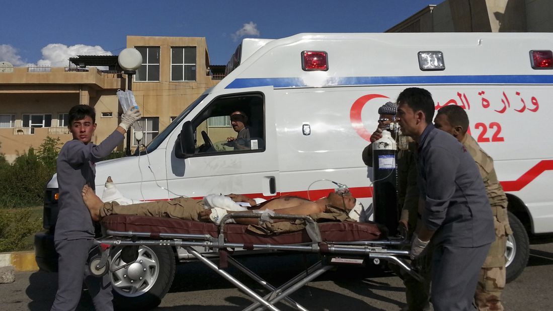 A Kurdish Peshmerga soldier who was wounded in a battle with ISIS is wheeled to the Zakho Emergency Hospital in Duhuk, Iraq, on Tuesday, September 30.