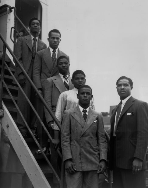 The history of Black Britain is often told from 1948, the year the "Empire Windrush" ship arrived on British soil. Images like this one are easily retrievable from a brief internet search, but the aim of Black Chronicles II is to go back even further. <br /><br />Jamaican boxers Charles Smith, Ten Ansel, Essi Reid, John Hazel, Boy Solas and manager Mortimer Martin are pictured arriving at Tilbury on the Empire Windrush.