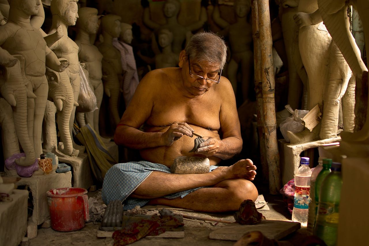 An artisan creates <a href="http://ireport.cnn.com/docs/DOC-1027924">traditional statues</a> of Hindu gods and goddesses in Kolkata, India. One idol takes 10 to 15 days to be completed.