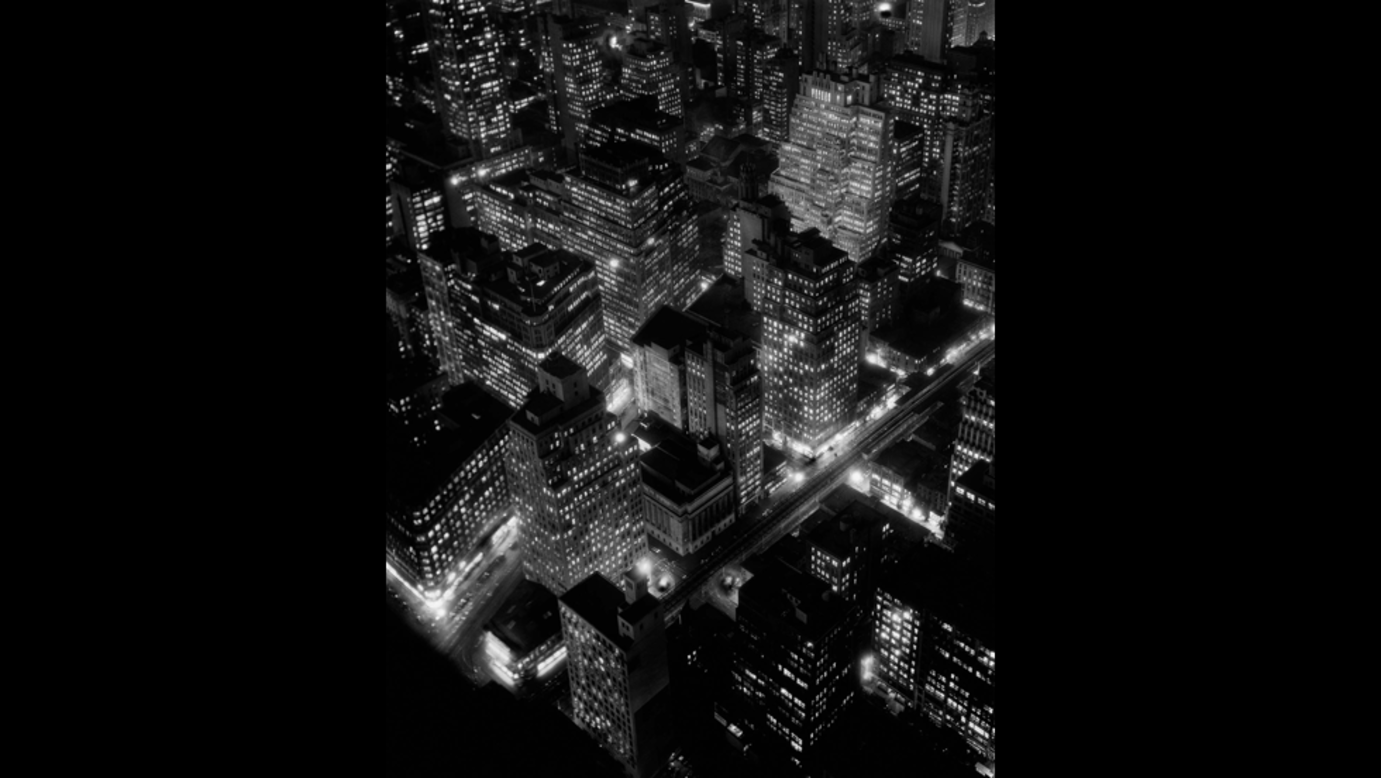 <strong>Berenice Abbott</strong><br /><br />Berenice Abbott's celebrated images depict New York on the cusp of becoming the global hub it is today<br /><br />In one 1932 photo Abbott painstakingly captures the new skyscrapers and a new type of city -- the unsleeping, modernist city with extremes of wealth and poverty -- as it bursts into life<br /><br />The shot taken in 1934 reportedly required a 15 minute exposure. Abbott captured it and created one of the most enduring shots of the changing city.