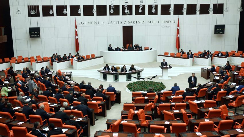 Turkish Parliament members convene to vote on a motion submitted by the government seeking a green light for the use of Turkish troops in the neighbouring countries as well as for foreign forces to transit Turkish territory in operations against Islamic State (IS) jihadists, at the Parliament in Ankara on October 2, 2014. The debate comes after President Recep Tayyip Erdogan last week indicated Turkey was shifting its policy to take a more active role in the fight against IS militants, who have advanced to within a few kilometres of the Turkish border in northern Syria. AFP PHOTO/ADEM ALTAN        (Photo credit should read ADEM ALTAN/AFP/Getty Images)