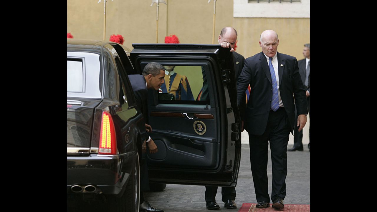 Clancy, right, holds the door for Obama during a trip to the Vatican in July 2009.