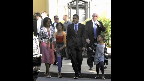 Clancy, right, walks with the first family after they attended church in October 2009.