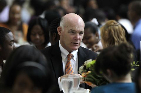 Clancy talks with students in Detroit during a youth leadership and mentoring luncheon in May 2010.