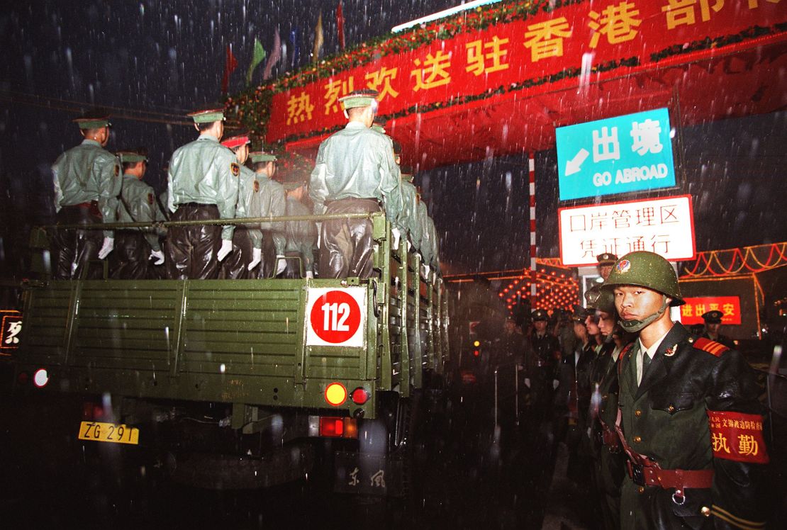 Convoys of PLA trucks and armoured vehicles cross into Hong Kong on July 1, 1997.