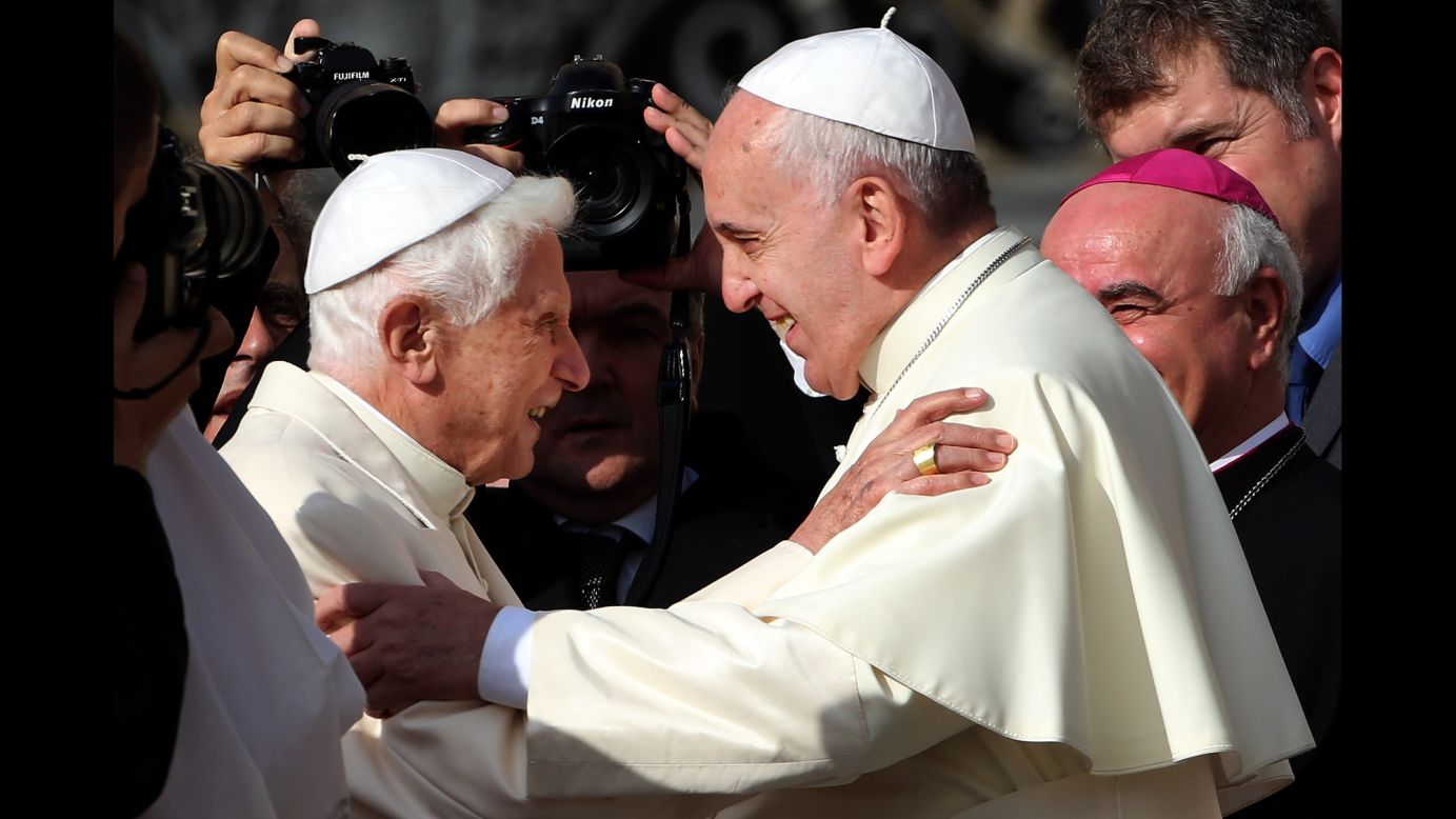 Pope Francis, right, greets Pope Emeritus Benedict XVI as he arrives at St. Peter's Basilica on Sunday, September 28.