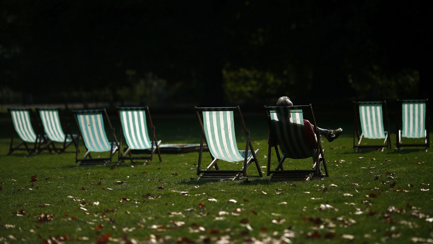 A visitor at London's St. James' Park enjoys the sunshine on Tuesday, September 30.