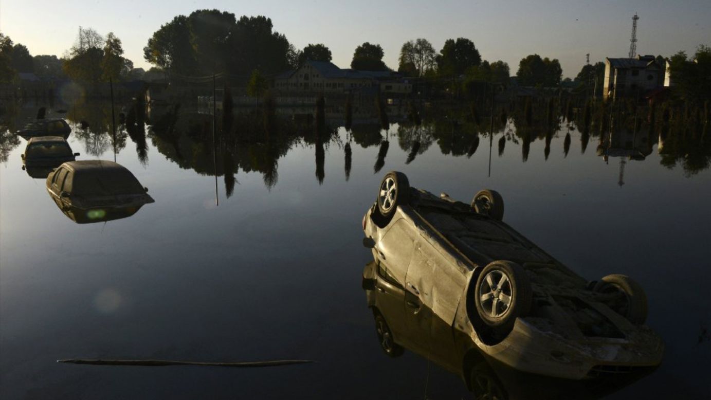 Vehicles are partially submerged in a flooded neighborhood of Srinagar, India, on Friday, September 26. Recent flooding brought by heavy monsoon rains <a href="http://www.cnn.com/2014/09/13/world/asia/india-pakistan-monsoon-flooding/">has wrought death and destruction</a> in India and Pakistan since the rains began on September 2.