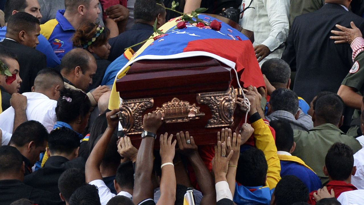 Government supporters carry the coffin with the remains of Venezuelan deputy Robert Serra to the National Assembly in Caracas on October 2, 2014. A lawmaker allied with Venezuela's socialist government and his female companion were found murdered in Caracas, a crime roundly condemned Thursday by President Nicolas Maduro. The bodies of Robert Serra, 27, and his partner Maria Herrera, were found at his home late Wednesday. Officials said they had been fatally stabbed. AFP PHOTO/FEDERICO PARRA (Photo credit should read FEDERICO PARRA/AFP/Getty Images)