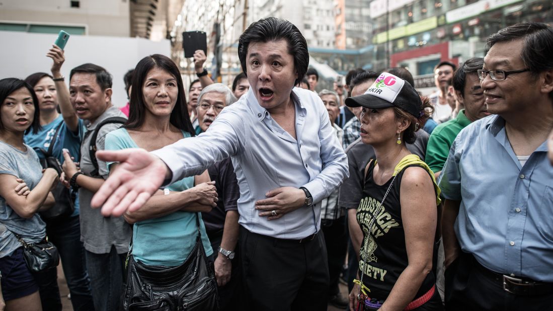 A man shouts at a pro-democracy demonstrator on October 3.