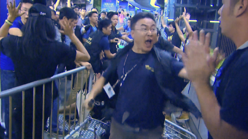 Hong Kong Police push through barricade