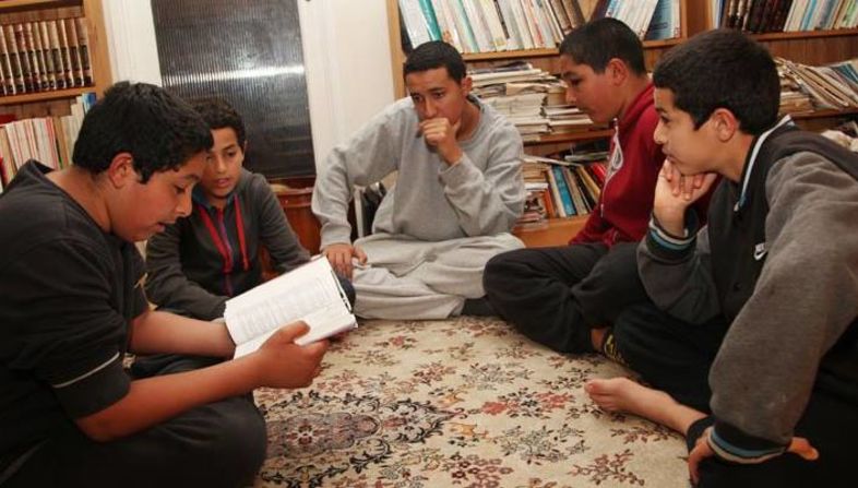 The Deghayes brothers sit and study the Quran. They are British born and bred. Abdullah (front left), Amer (center) and Jaffar (front right) left their home in Brighton and headed to fight for the al-Nusra Front in Syria. Abdullah died fighting the Syrian regime forces in April.
