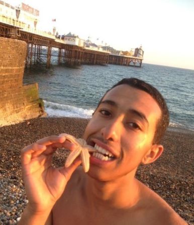 Amer Deghayes poses on Brighton Beach near the pier. The teenager left his British seaside home to join the al Qaeda-affiliated al-Nusra Front in Syria. Two of his younger brothers and another childhood friend followed him to the combat zone earlier this year.