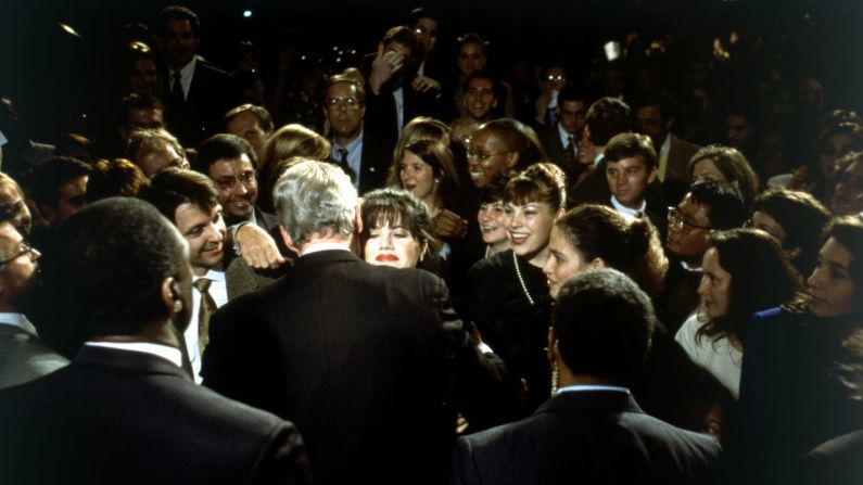 White House intern Monica Lewinsky embraces Clinton at a Democratic fundraiser in Washington, DC, in October 1996.
