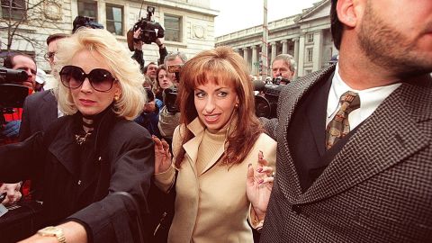 Paula Jones, center, arrives at the office of a lawyer representing Clinton in January 1998. The former Arkansas state employee filed a federal civil lawsuit in 1994 accusing Clinton of making 
