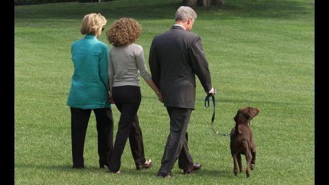 Hillary, Chelsea and Bill Clinton depart the White House with Buddy on August 17, 1994.