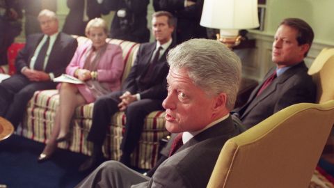 Clinton answers questions from reporters in December 1998 before the start of a meeting with his foreign policy team. After a December 16 military strike on Iraq, Clinton warned Iraqi President Saddam Hussein against threatening his neighbors. Clinton also indicated his determination to complete the operations that continued the next day with renewed bombing of Iraqi sites suspected of housing parts to manufacture weapons of mass destruction.