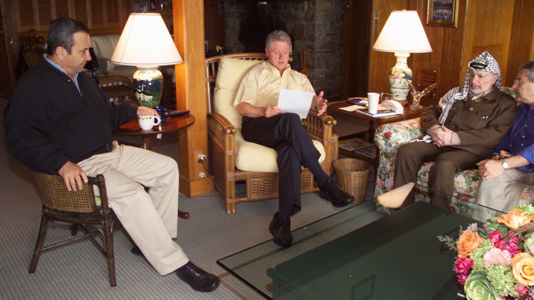 Clinton meets with Israeli Prime Minister Ehud Barak, left, and Palestinian Authority Chairman Yasser Arafat at Maryland's Camp David in July 2000. It was at the end of a Mideast peace summit. The talks ended without an agreement.  