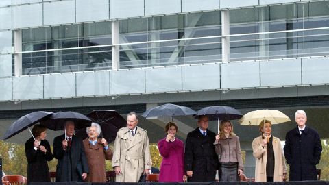 Clinton attends the inauguration of his presidential library and museum in Little Rock, Arkansas, in November 2004. Clinton was joined, from right, by his wife, his daughter, former President George W. Bush, first lady Laura Bush, former President George H.W. Bush, former first lady Barbara Bush, former President Jimmy Carter and former first lady Rosalynn Carter.