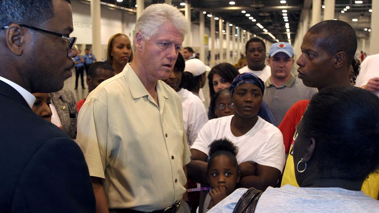 Clinton visits Hurricane Katrina evacuees in Houston in September 2005. That same day, Clinton and former President George H.W. Bush announced the formation of the Bush-Clinton Katrina Fund to assist victims.