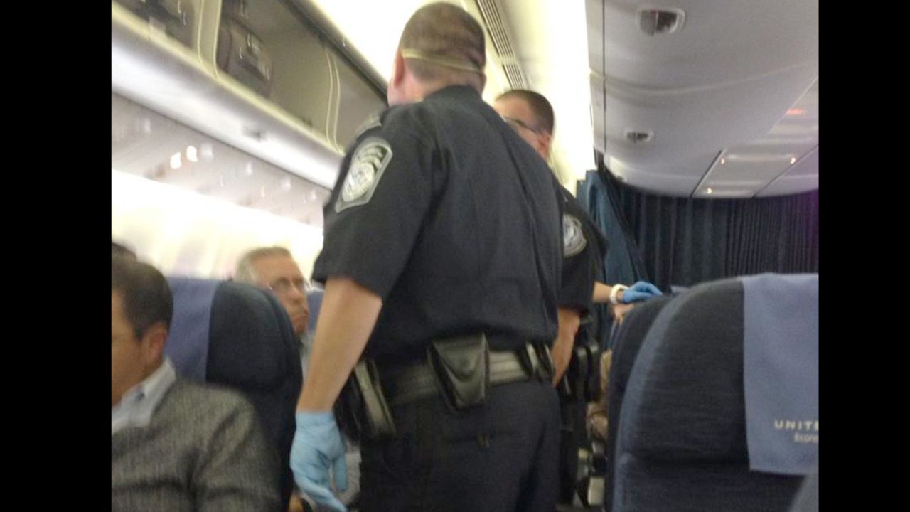 Passenger Paul Chard tweeted a photo of emergency responders on the plane.