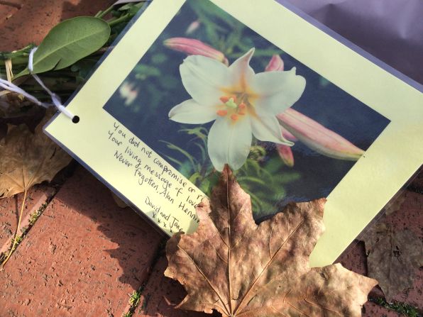 Friends, family and mourners laid flowers and messages for Henning in his home town of Eccles, northern England, over the weekend.