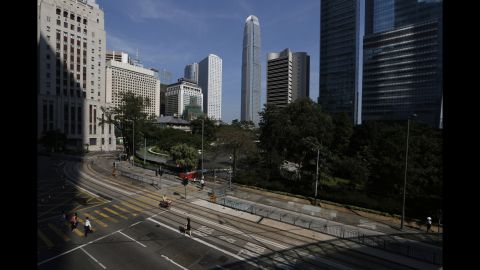 People walk to work on a main road in the occupied areas of Hong Kong on October 6.