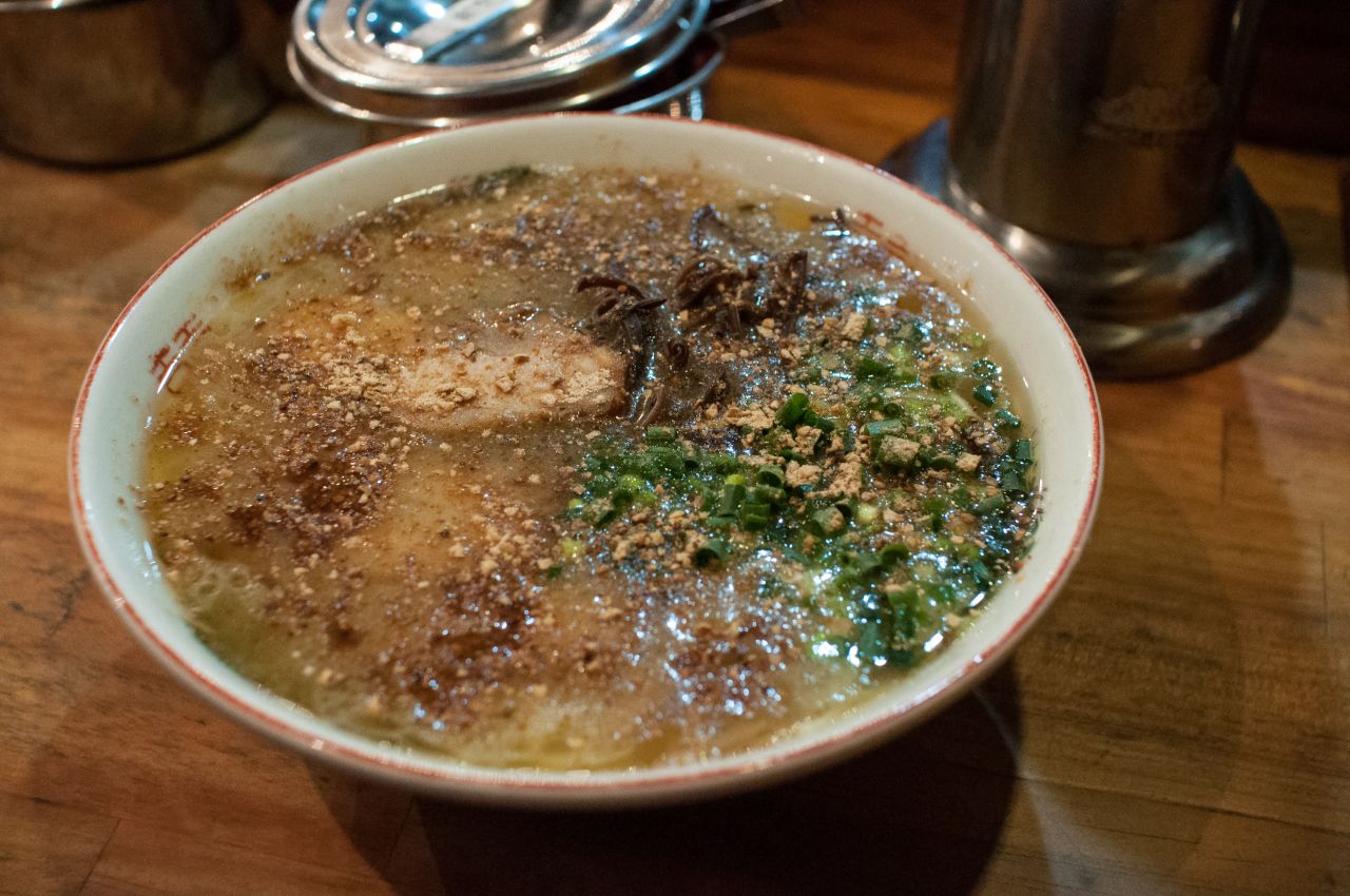Kumamoto ramen's garlic hit comes in the form of black oil called mayu. Served with extra garlic chips on the side, it's a great late night snack.