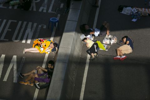 A ray of sunlight bathes sleeping protesters as they occupy a major highway in Hong Kong on October 6. Protesters say Beijing has gone back on its pledge to allow universal suffrage in Hong Kong, which was promised "a high degree of autonomy" when it was handed back to China by Britain in 1997.