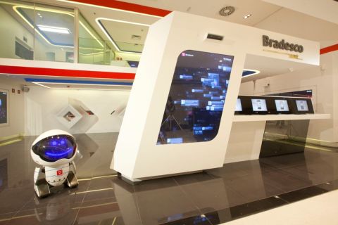 Bradesco Next, designed by YDreams, is located in Sao Paulo, Brazil. This innovative branch features multi-app walls and even houses a little robot, Link 237, who greets visitors. 