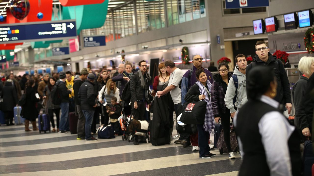 Travelers wait to check-in at Chicago's O'Hare International Airport in 2013. Based on new FAA statistics, the city declared O'Hare the world's busiest airport on Thursday.