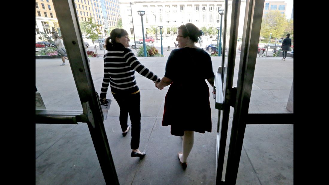 Abbi Huber, left, and Talia Frolkis exit the City County Building in Madison, Wisconsin, after applying for a marriage license on October 6, 2014.