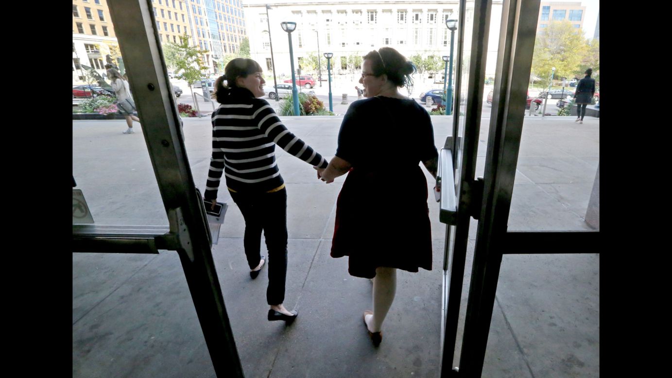 Abbi Huber, left, and Talia Frolkis exit the City County Building in Madison, Wisconsin, after applying for a marriage license on October 6, 2014.