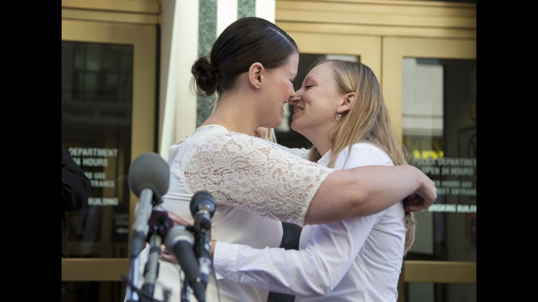 Jennifer Melsop, left, and Erika Turner kiss after they were married in front of the Arlington County Courthouse in Arlington, Virginia, on October 6, 2014.