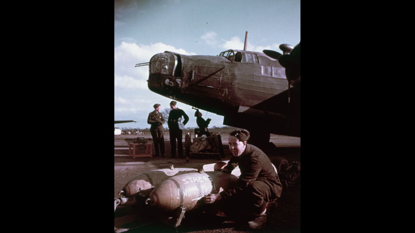 Ground crews load bombs onto a Vickers Wellington plane circa 1943.