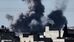 aption:Smoke rises from the southwest of the Syrian town of Ain al-Arab, known as Kobane by the Kurds, following air strikes as seen from the Turkish-Syrian border in the southeastern town of Suruc, Sanliurfa province, on October 7, 2014. Fresh air strikes by the US-led coalition hit positions held by Islamic State jihadists in the southwest of the key Syrian border town of Ain al-Arab (Kobane), according to an AFP journalist just across the border in Turkey. The strikes came a day after the extremists pushed into Kobane, seizing three districts in the city's east after fierce street battles with its Kurdish defenders. AFP PHOTO / ARIS MESSINIS (Photo credit should read ARIS MESSINIS/AFP/Getty Images)