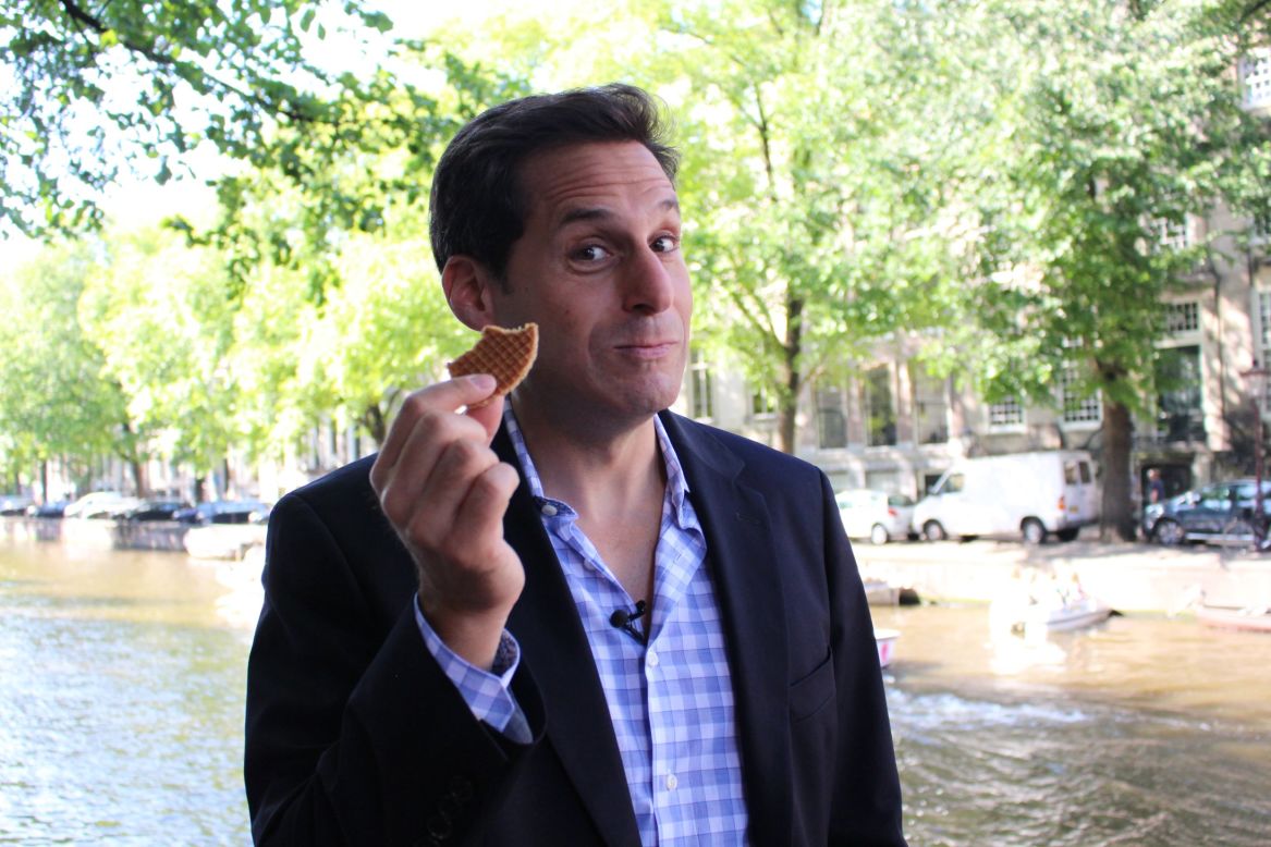 Berman samples a "stroopwafel," a Dutch treat literally translated as "syrup waffle." It is made from two thin layers of baked dough with a caramel-like syrup filling in the middle.
