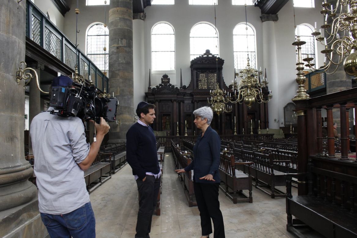 Inside the 339-year-old Portuguese Synagogue in Amsterdam, Netherlands, CNN's John Berman interviews Hetty Berg, chief curator and manager of museum affairs for the Jewish Historical Museum in Amsterdam. This historic synagogue was the center of the Jewish Quarter in Amsterdam during the 1700s and 1800s when Berman's ancestors lived there. It is still in use today.